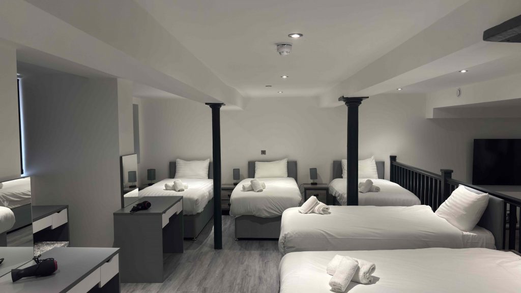 Comfortable group accommodation bedrooms at Happy Days Apartments